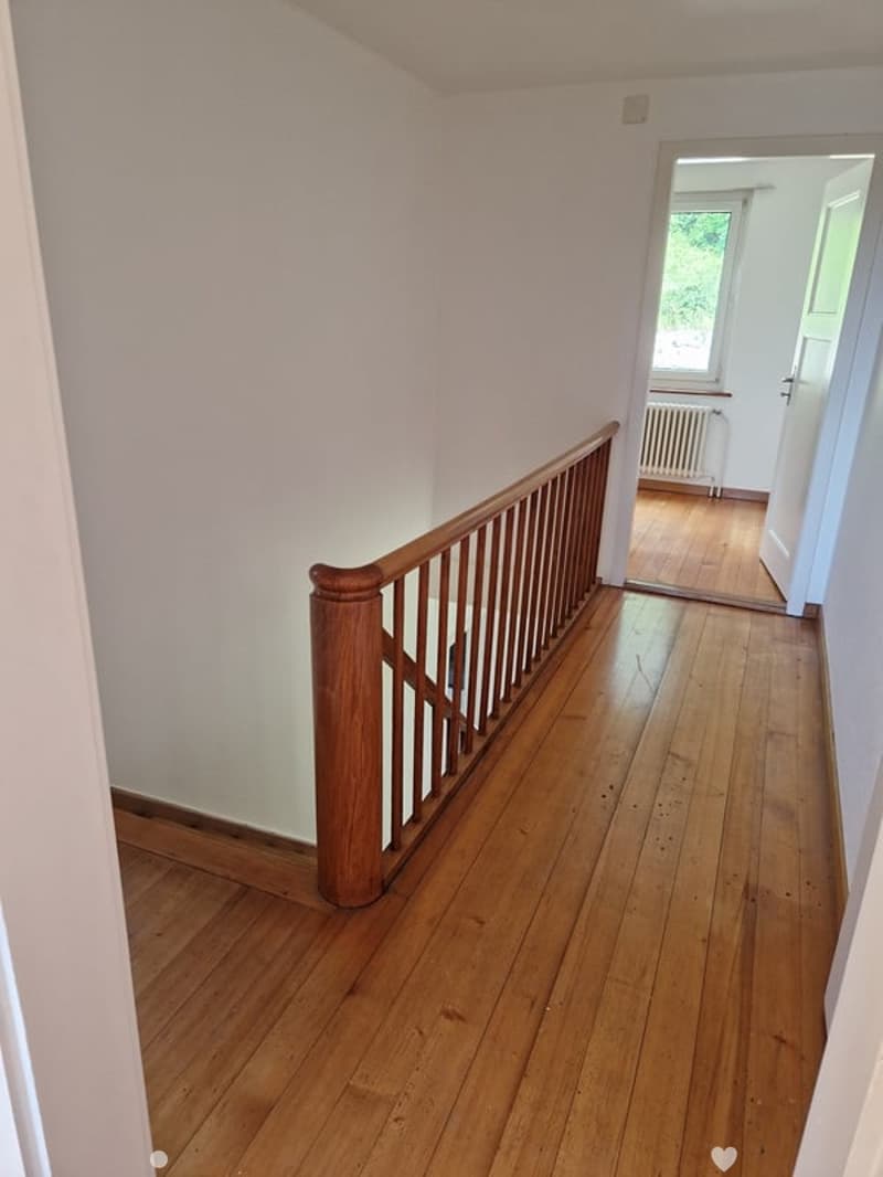 white wall, wooden flooring, wooden staircase