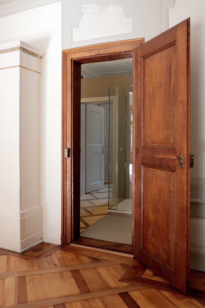 wooden door, wooden floor, white walls, glass door
