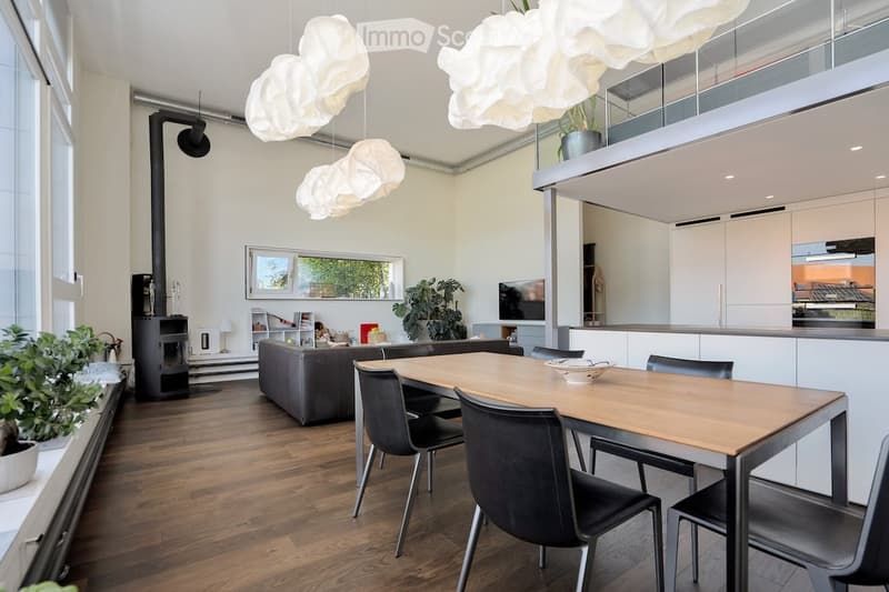 dining table, modern chairs, open living room, large windows, elevated balcony, chandeliers