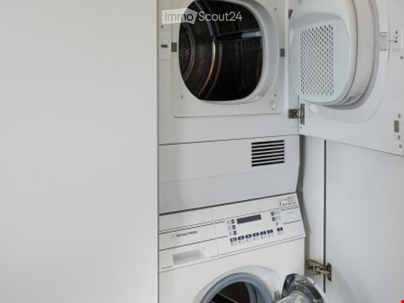 stacked washing machine and dryer, dishwasher, white appliances
