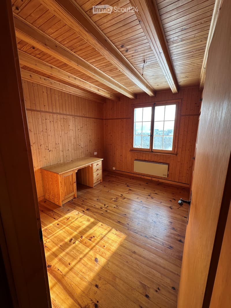 large wooden desk, wooden wall, large window, wooden floor