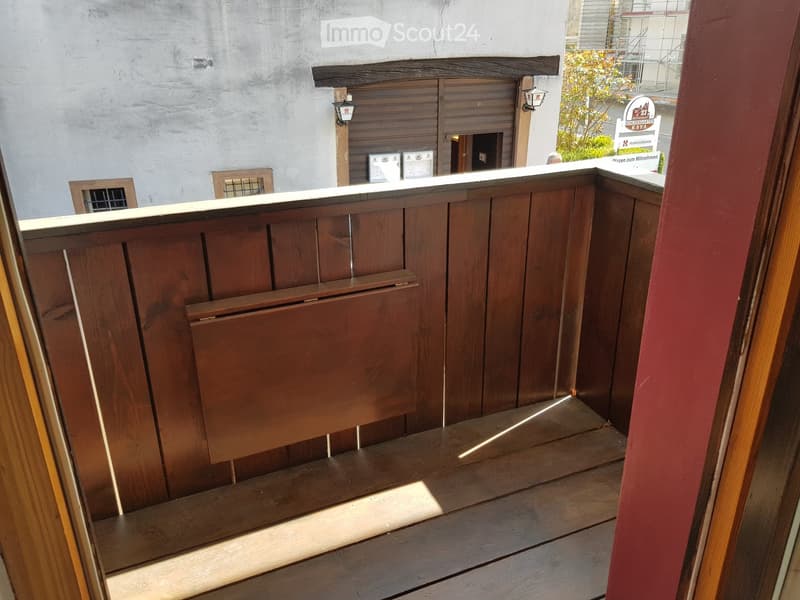 wooden railing, wooden floor, wooden box in the wall