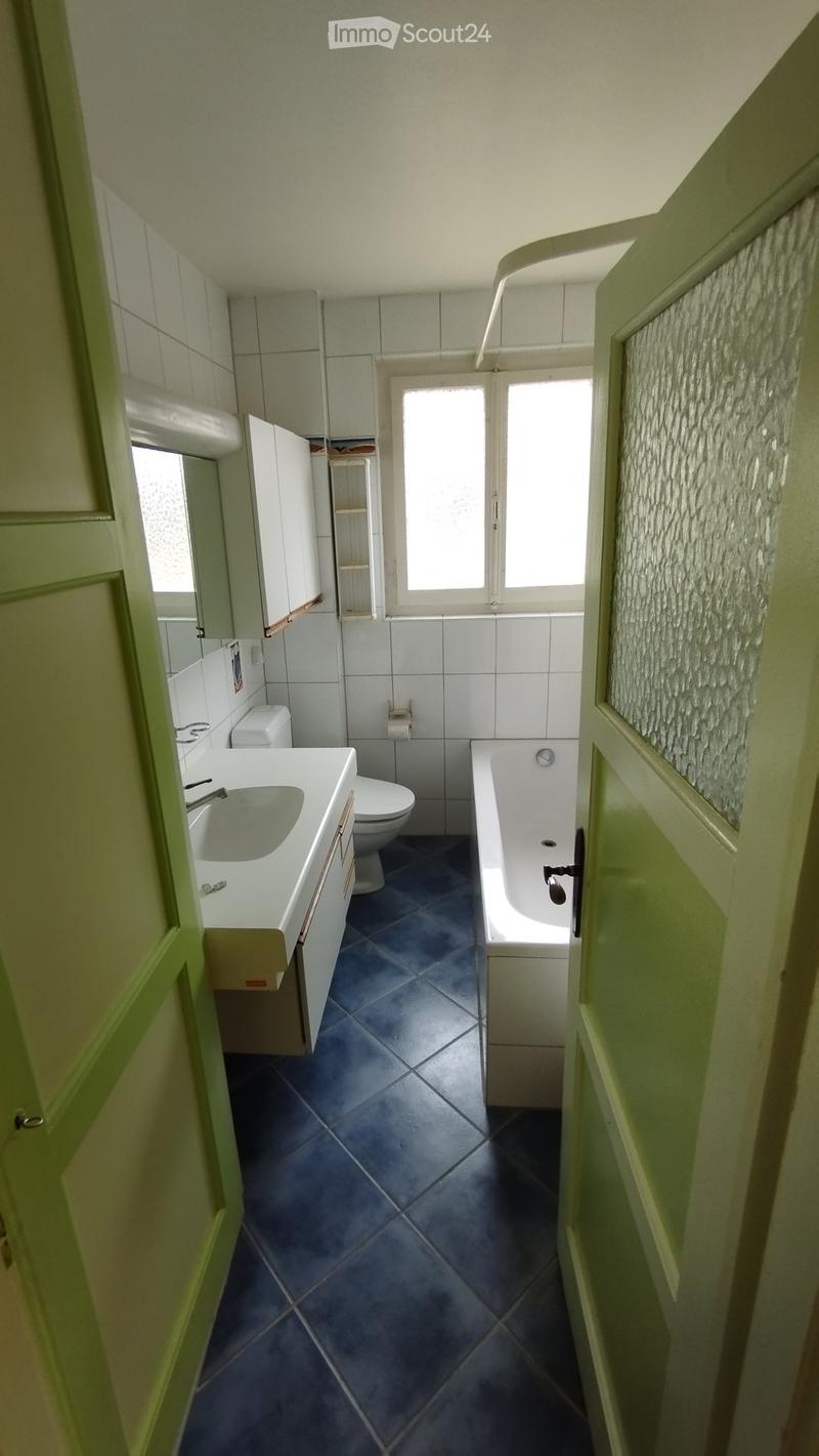 Bathroom with sink, toilet, bathtub and mirror