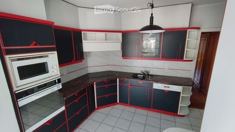 kitchen with modern cabinets, sink, white dishwasher, integrated oven and microwave, tiled floor