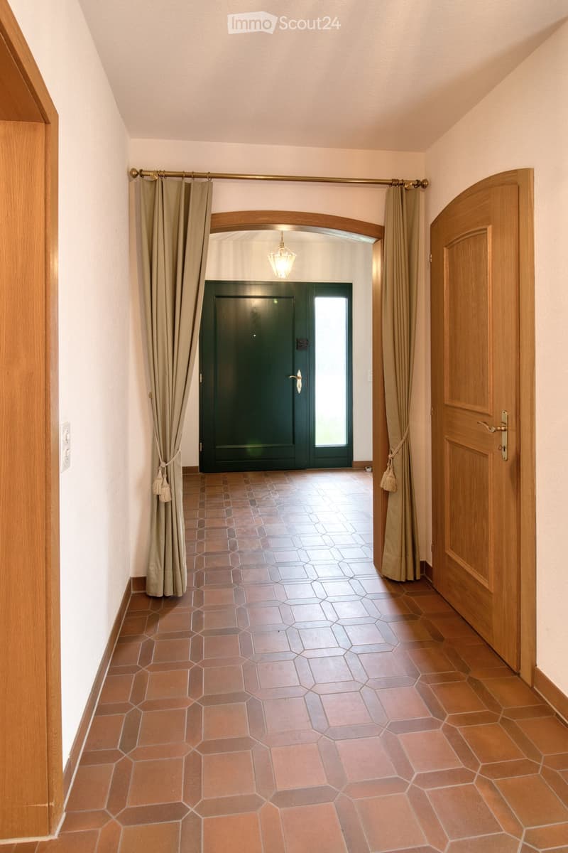 Wooden doors, tiled floor, wall switch, window with door