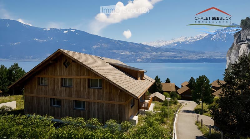 A modern wooden chalet set amidst nature, offering stunning views of the mountains and the lake