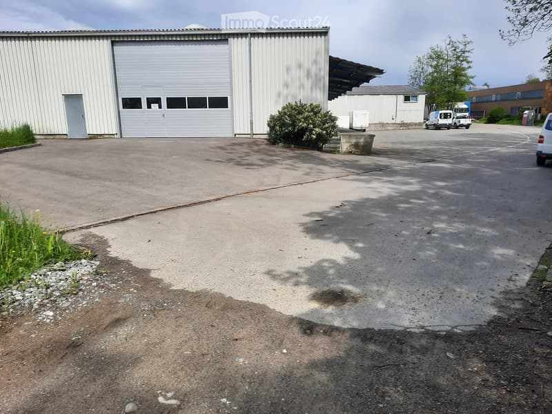 empty car park in front of a garage building