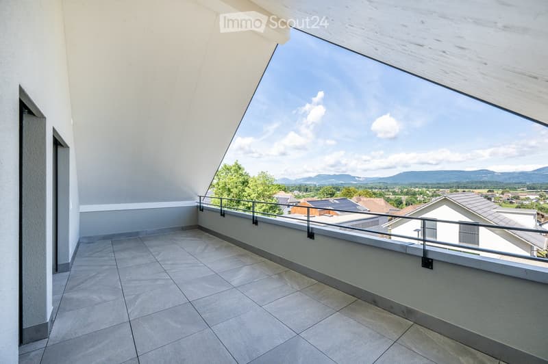 large balcony with tiled floor, metal railing, panoramic view of the mountains