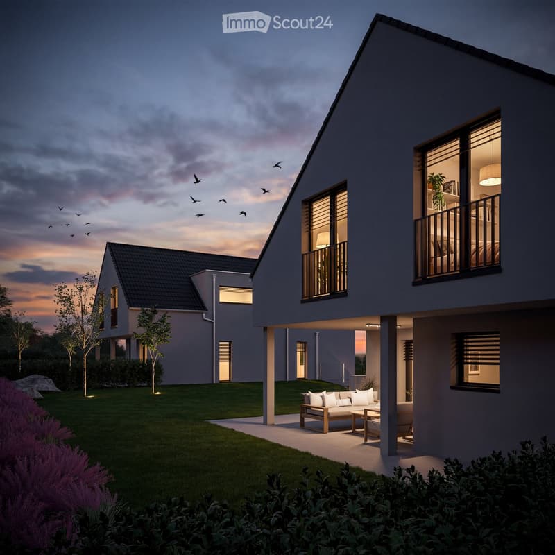Modern house, two stories, gray exterior, black roof, large windows, balcony, outdoor seating area, well-lit at night, garden with trees and shrubs