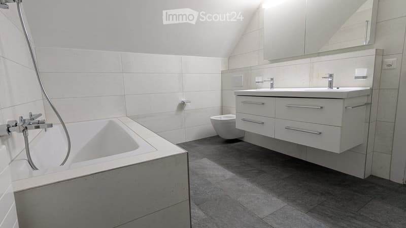 Bathtub, Toilet, Vanity, Mirror, Tiled walls and floor