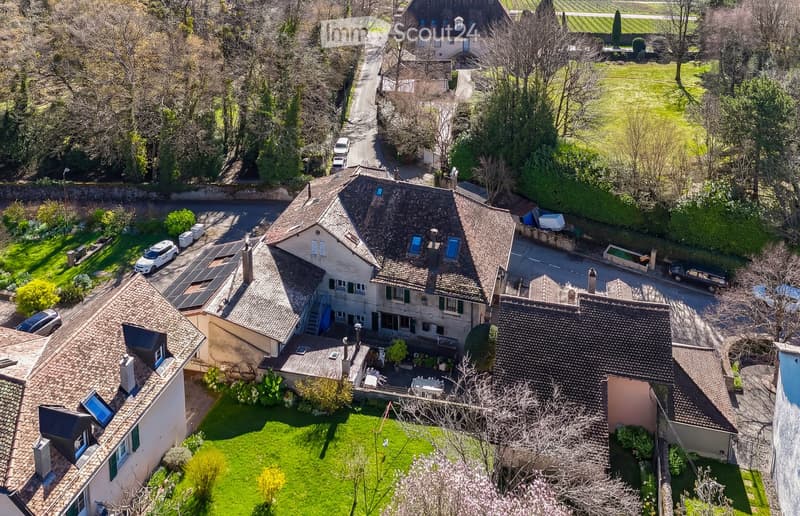 large house, multiple roofs, solar panels, multiple parking spaces, terrace, garden, swimming pool, fireplace, view