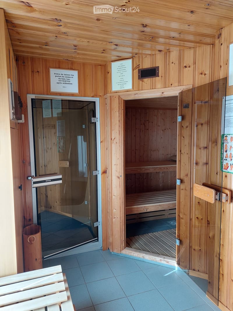 wooden walls, wooden benches, glass doors, tiled floor, wooden bench