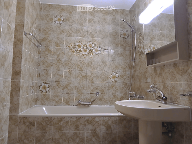 Bathroom with bathtub, sink, shower, and floral tiles