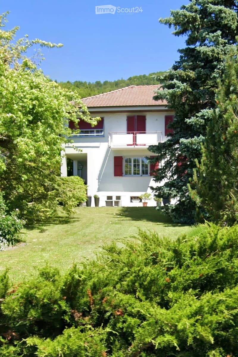 2 story house, red roof, white walls, red shutters, balcony, garden, trees
