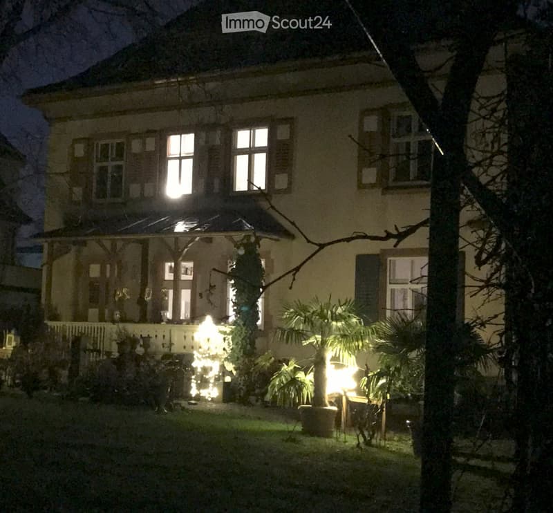 2 story house, white exterior, multiple windows, covered porch, outdoor plants, Christmas lights