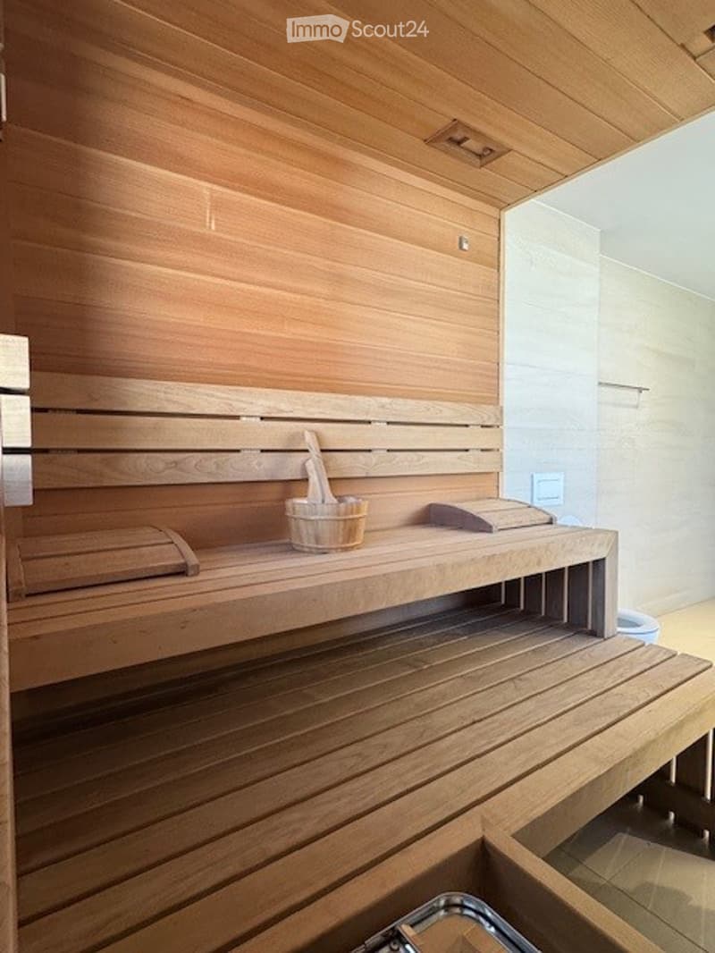 wooden sauna with benches, wooden bucket, wooden ladle, wooden towel