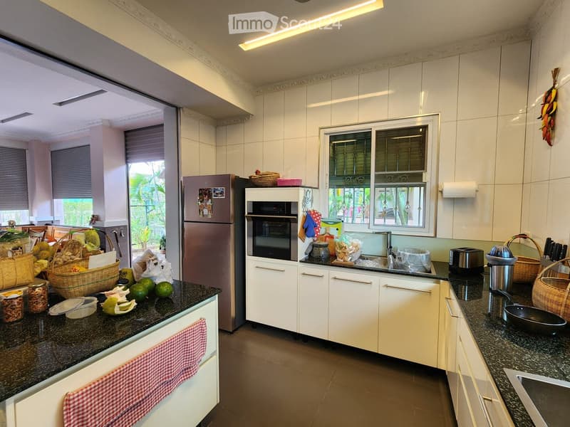 modern kitchen, granite countertops, stainless steel appliances, white cabinets, tiled backsplash, open shelving, large windows, natural light