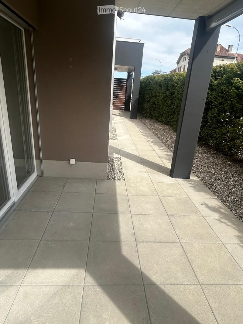 tiled floor, glass door, balcony, gravel path, hedges, street light