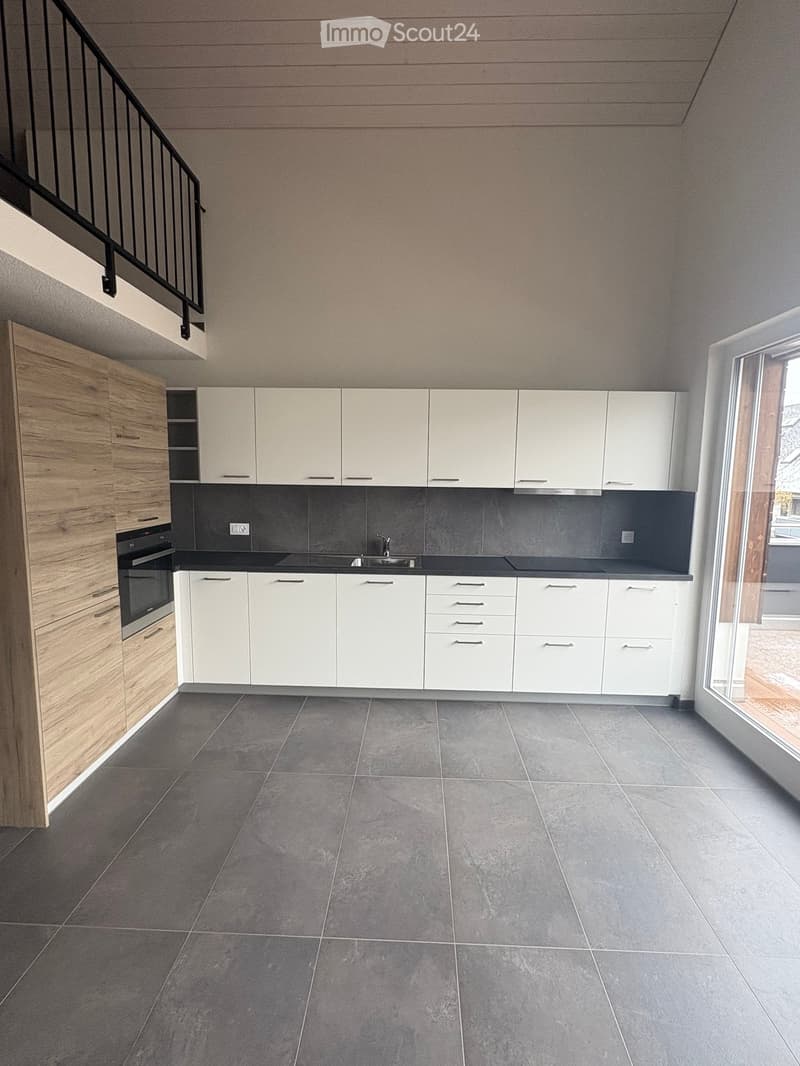 modern kitchen, white cabinets, black countertops, stainless steel sink, oven, tiled floor, balcony