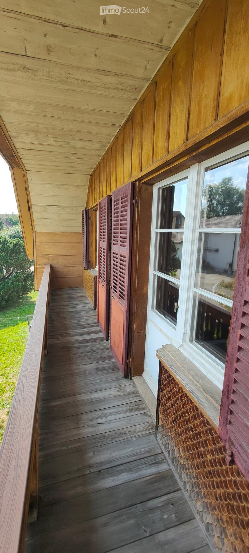 wooden floor, wooden railing, wooden wall, wooden door, window, wooden bench