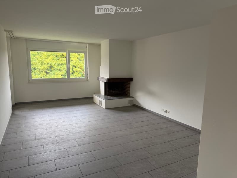 empty room, fireplace, large window, tiled floor, white walls