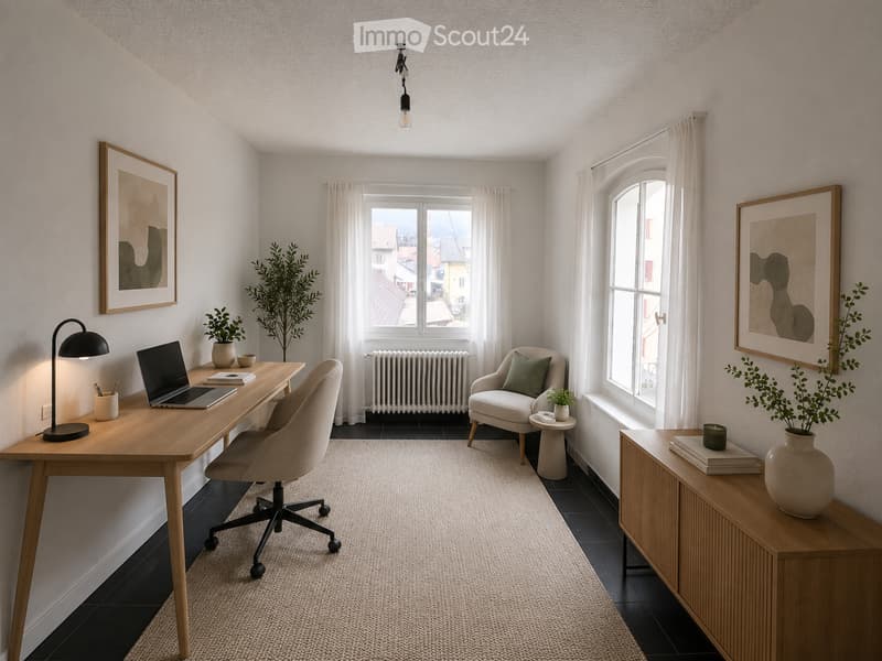 A modern, well-lit room with a wooden desk, laptop, chair, side table, and decorative plants. The space features large windows with white curtains, a cozy armchair, and artwork on the walls.