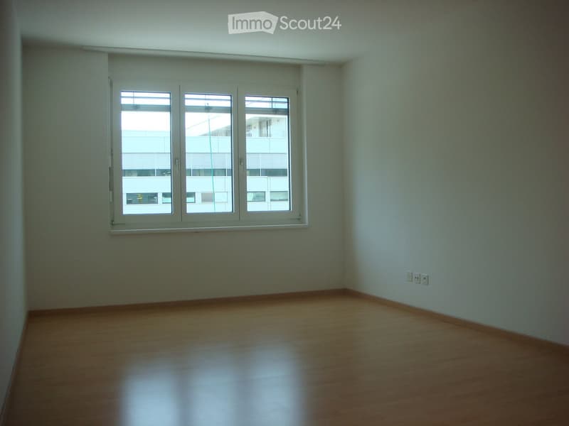 empty room, white walls, wooden floor, window with blinds, power outlets