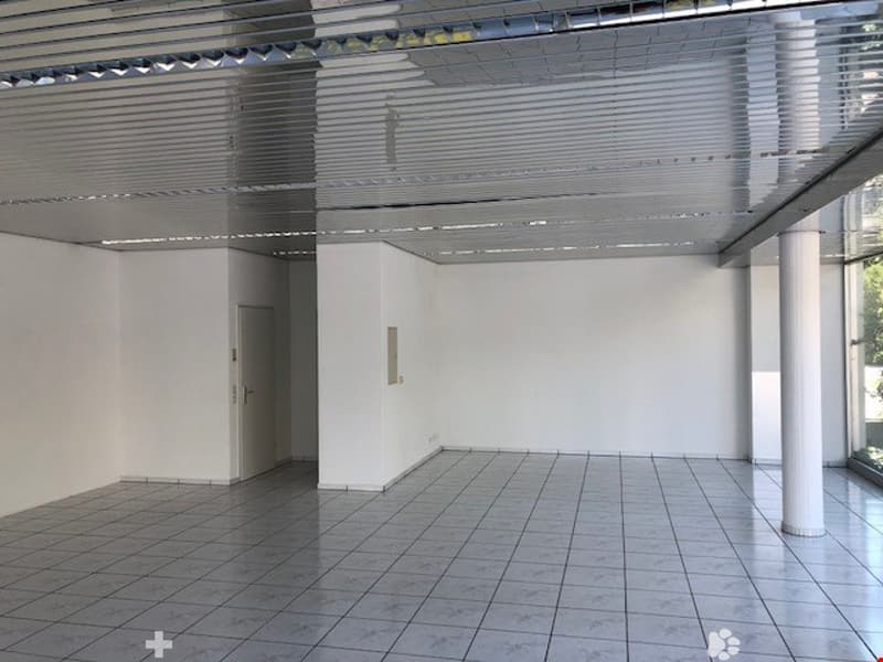 empty room, white walls, white tiled floor, metal ceiling, white door, glass window