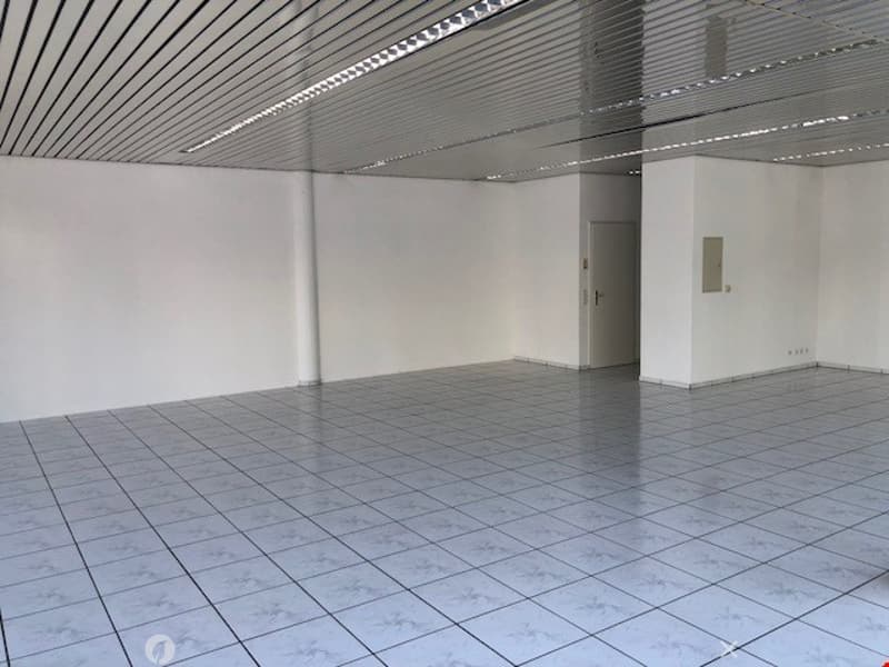 empty room, white walls, white tiles, metal ceiling, door, power outlet