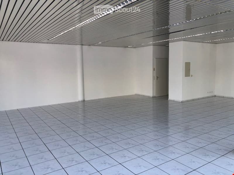 empty room, white walls, white tiles, metal ceiling, door, power outlet