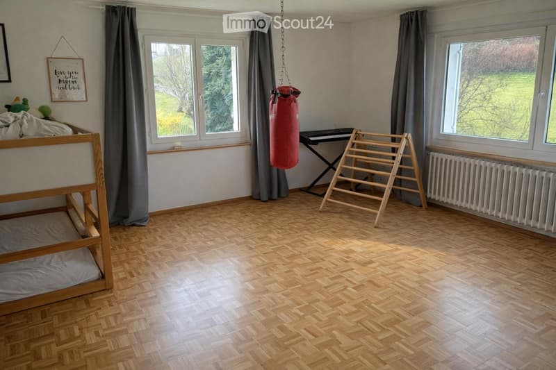 empty room, wooden floor, bunk bed, punching bag, piano, radiator, windows, curtains