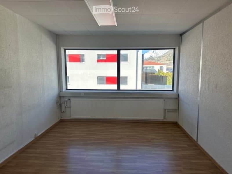 empty room, wooden floor, white walls, large window, white radiator