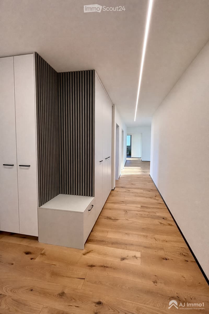 wooden floor, white walls, white cabinets, shoe rack, hallway