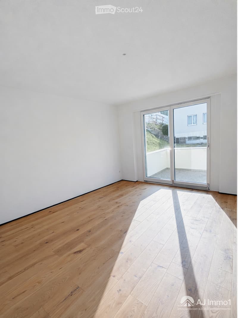 empty room, wooden floor, white walls, sliding glass doors, balcony