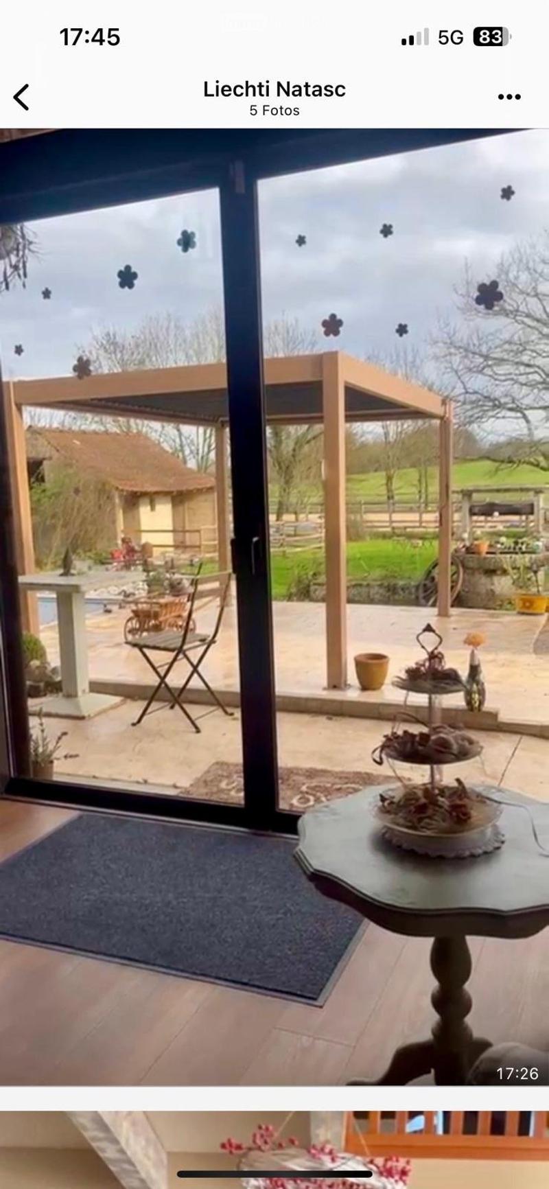 sliding glass door, balcony, patio, table, chair, pergola, garden, house, field