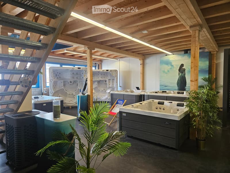 showroom with several hot tubs, wooden ceiling, plants, air conditioning units