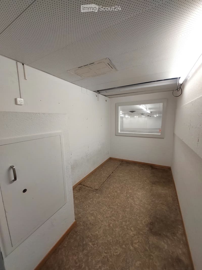empty room, white walls, white ceiling, white door, small window, brown floor