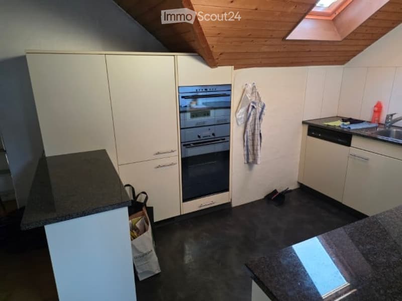 kitchen with white cabinets, black countertops, oven, dishwasher, sink, wooden ceiling