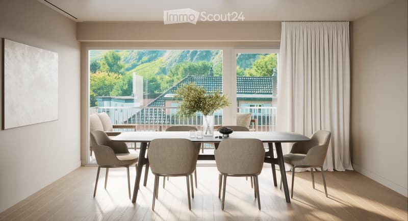 Dining room with a large table, chairs, and a balcony with a view of the mountains