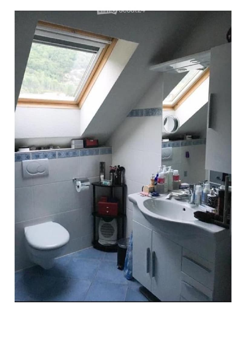 attic bathroom, modern fixtures, skylight window, blue tiles