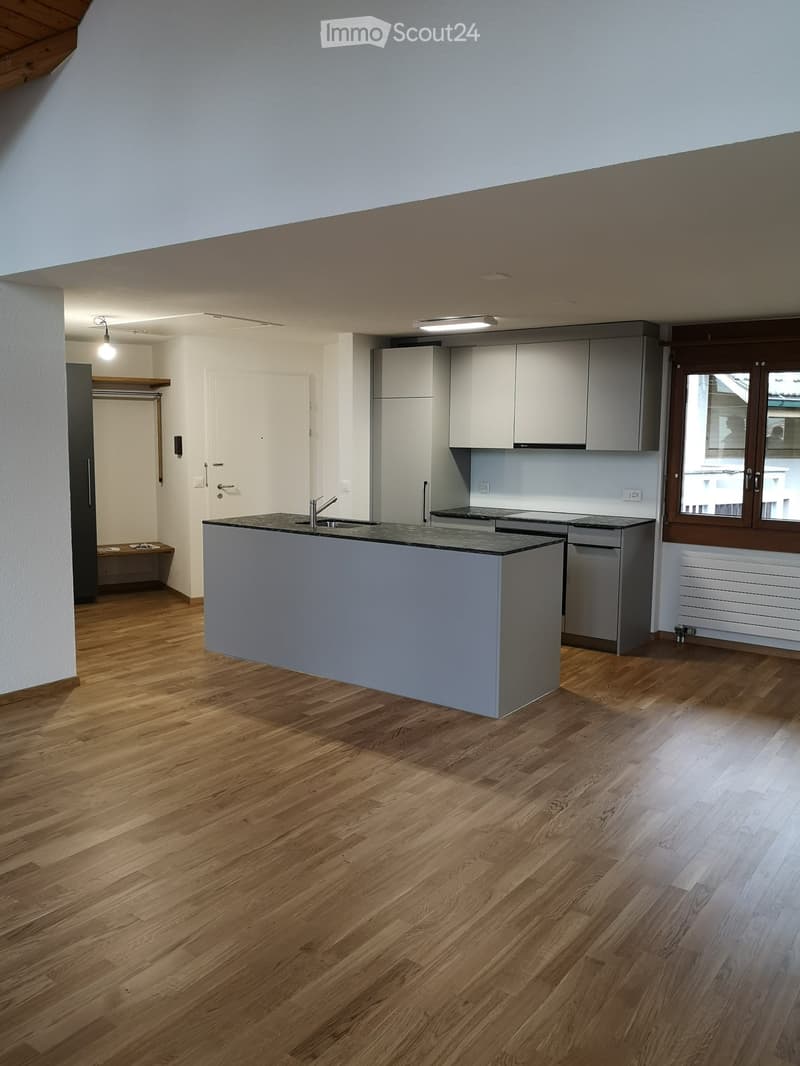 modern kitchen with island, wooden floor, white walls, gray cabinets, stainless steel sink, faucet, open door, window