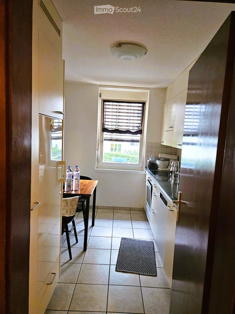 kitchen with dining area, white cabinets, tiled floor, window with blinds, refrigerator, table, chairs, dishwasher, washing machine