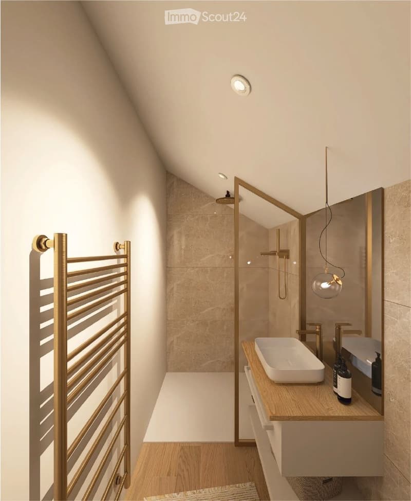 Modern bathroom with beige tiles, wooden floor, white sink, golden radiator, glass shower enclosure, and gold fixtures