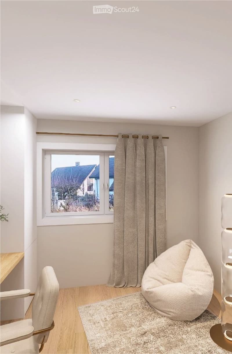 small room with a window, a bean bag chair, a desk, and a chair