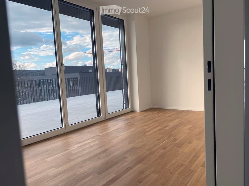 Empty room, hardwood floor, sliding glass doors, balcony, city view