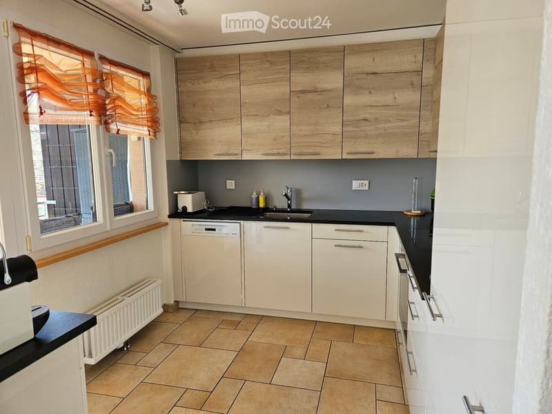 modern kitchen with white cabinets, wooden shelves, white walls, countertop, dishwasher, washing machine, tiled flooring