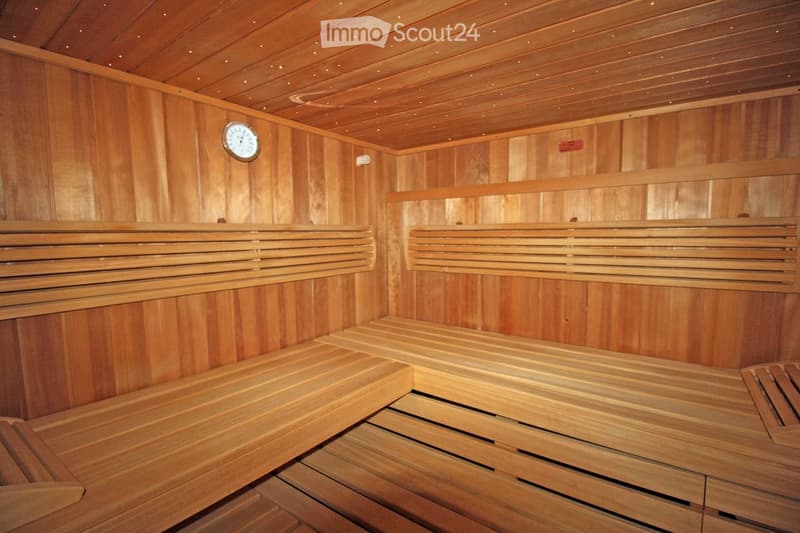 wooden walls, wooden benches, clock on the wall