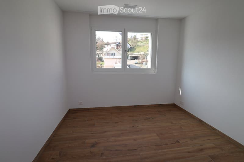 empty room, white walls, wooden floor, large window with view