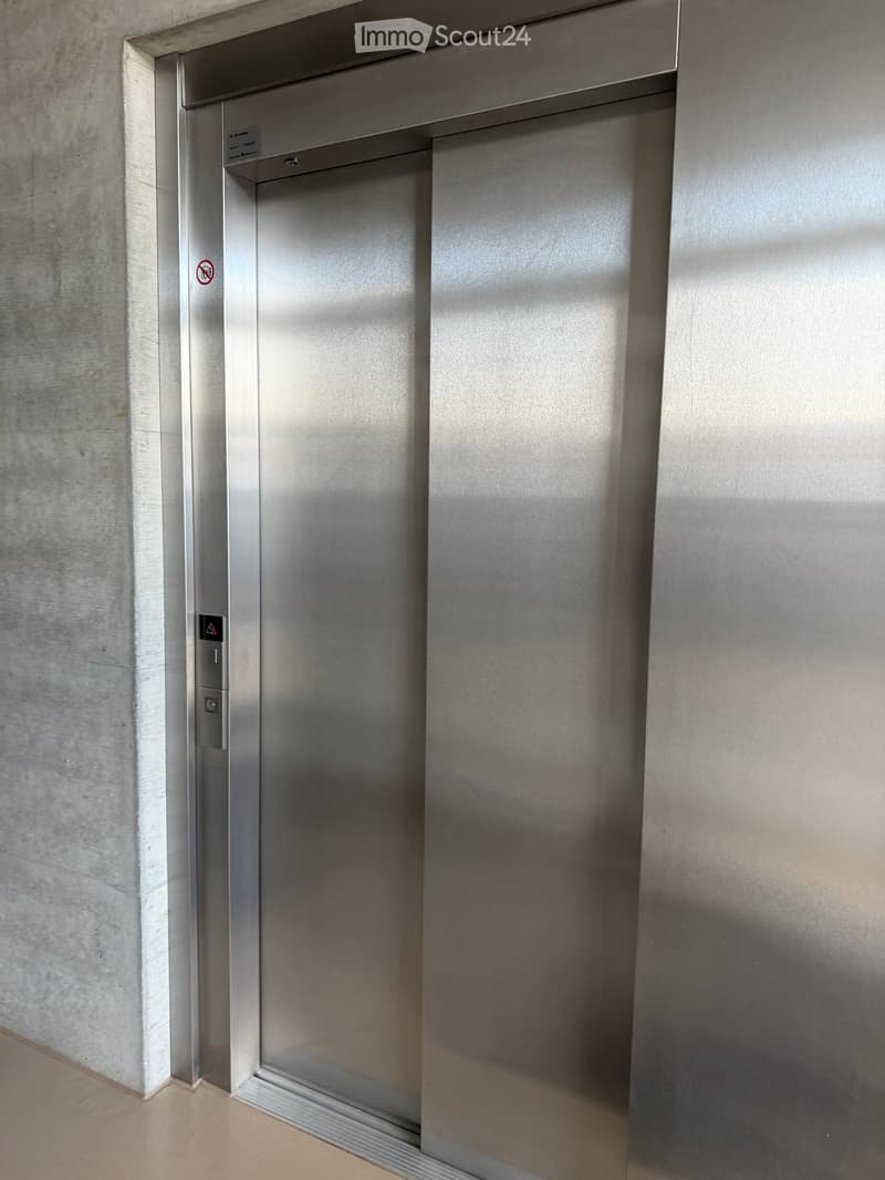 Stainless steel elevator with control panel and emergency button