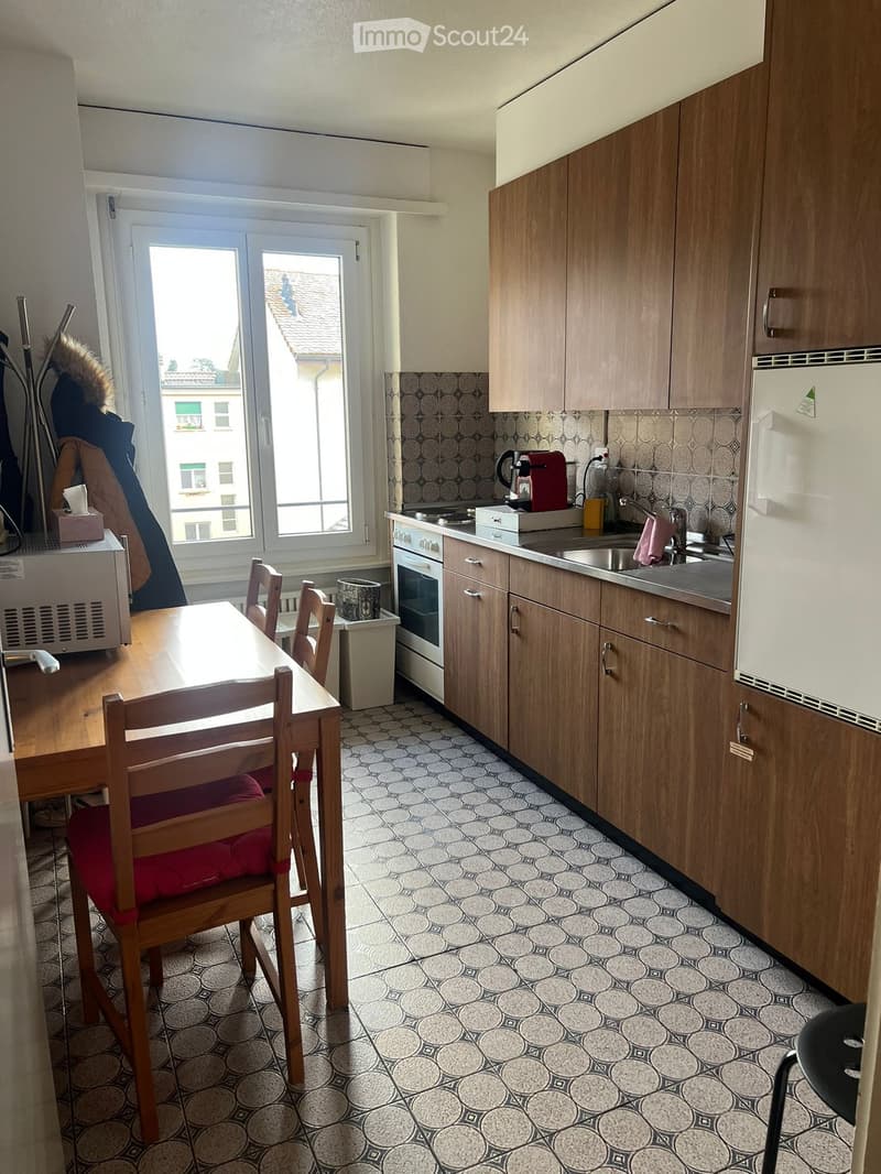 wooden furniture, kitchen with appliances, window, tiles on the floor